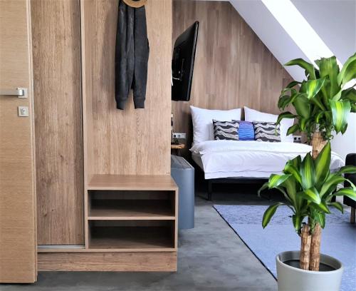 a living room with a bed and a closet at Mandula Villa in Tihany
