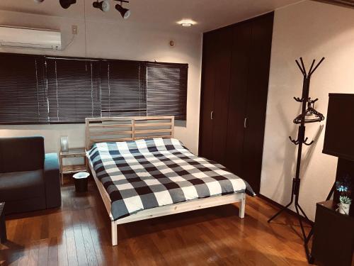 En eller flere senge i et værelse på 松戸1DK カップルに人気のシックなお部屋 Nomad松戸宿057
