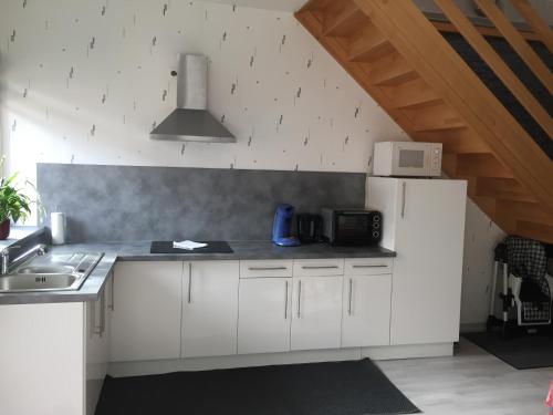 Kuchyň nebo kuchyňský kout v ubytování Appartement duplex chez Sandra