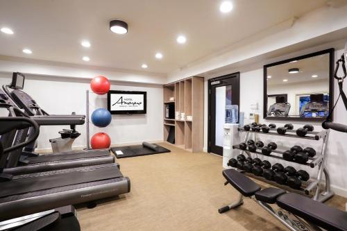 a fitness room with a gym with weights at Hotel Amarano Burbank-Hollywood in Burbank