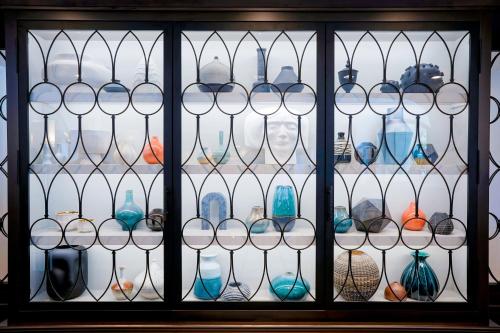 a window with a bunch of glass vases at Hotel Amarano Burbank-Hollywood in Burbank