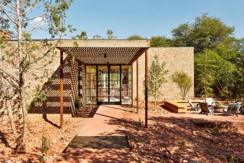 a brick house with a staircase leading to a patio at Enchantment Resort in Sedona