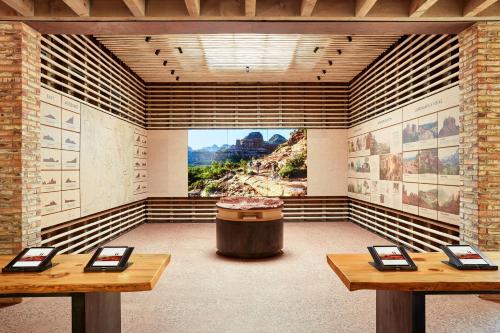 a room with two tables and a large window at Enchantment Resort in Sedona