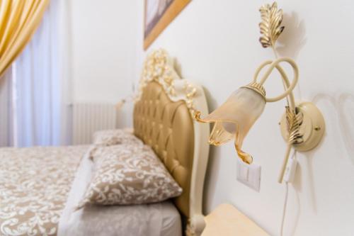 Postel nebo postele na pokoji v ubytování Palazzo Le Travi