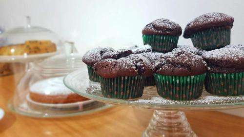 a plate of chocolate muffins on a table at Pepi B&B in Santa Maria di Castellabate