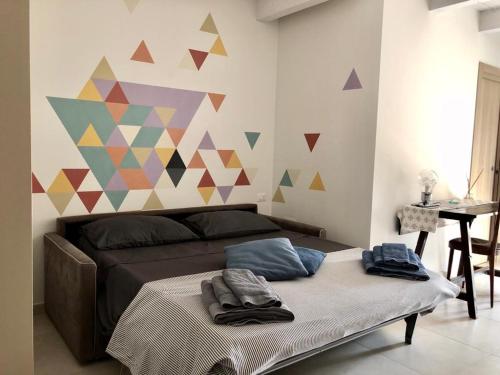 Postel nebo postele na pokoji v ubytování B&B Al Gravattone