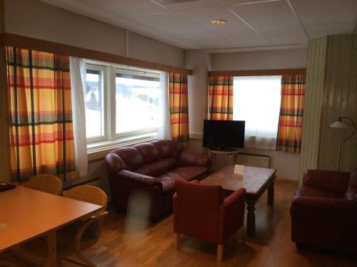 Телевизор и/или развлекательный центр в Vormsund Golf Hotell Bed Breakfast