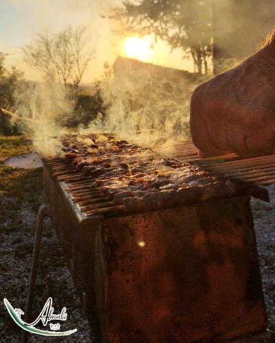 a grill with a bunch of food on it at B & B Almalù in Ripatransone