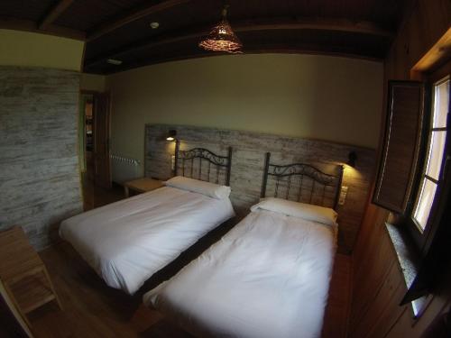 Postel nebo postele na pokoji v ubytování A Reboleira - Casa Nuñez