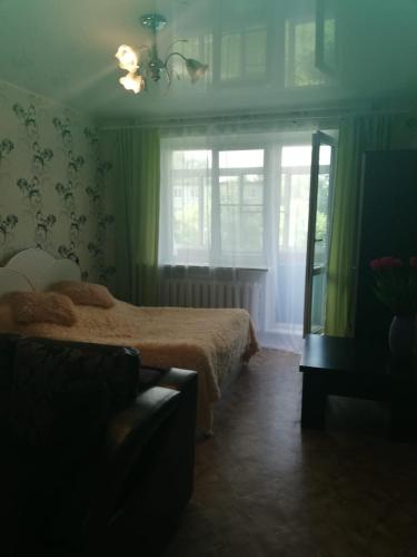 
Кровать или кровати в номере Apartment 2-ya Yuzhnaya
