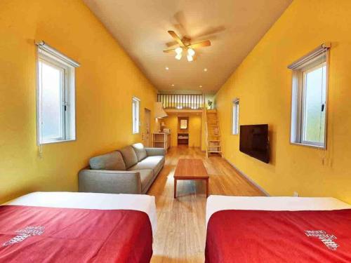 a living room with two beds and a couch at Kunigami-gun - Hotel - Vacation STAY 89678 in Inbu