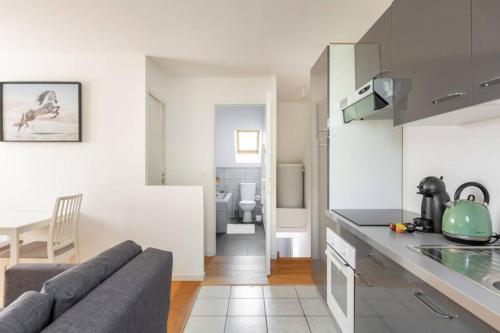 Kuchyň nebo kuchyňský kout v ubytování GRAND CONFORT, Appartement Osny