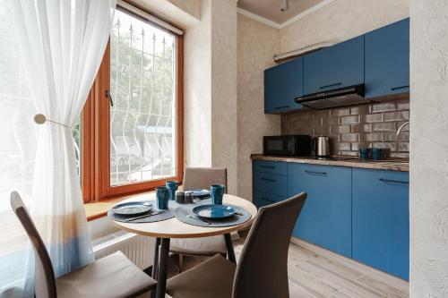 Kuchyň nebo kuchyňský kout v ubytování YUDGI - Home Hotel
