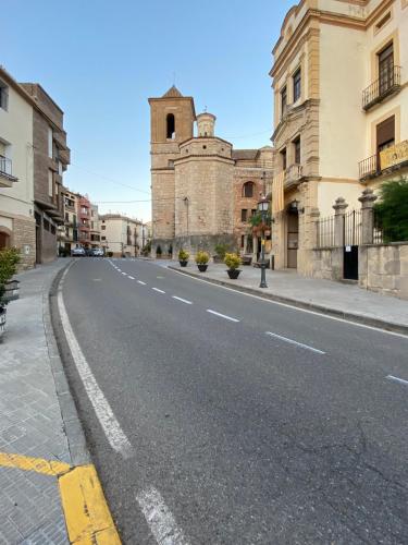 an empty street in front of a building at Apartaments Chenin Blanc-Priorat- in Cornudella
