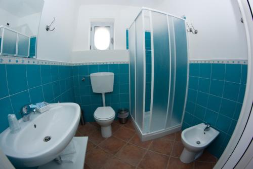 a bathroom with a sink and a toilet and a shower at Yachting Club Mare in Patti