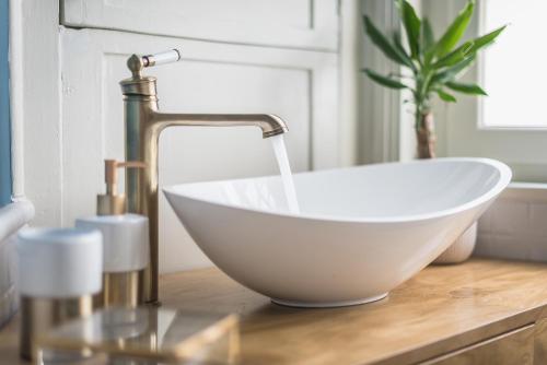 a sink with a faucet on top of a counter at Moon And Stars Athens in Athens