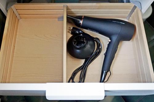 a black computer mouse in a wooden box at Charmantes, gemütliches Studio, im Zentrum - C2 in St. Moritz