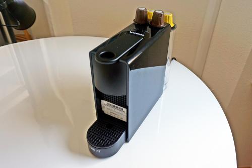 a phone is sitting on top of a table at Charmantes, gemütliches Studio, im Zentrum - C2 in St. Moritz