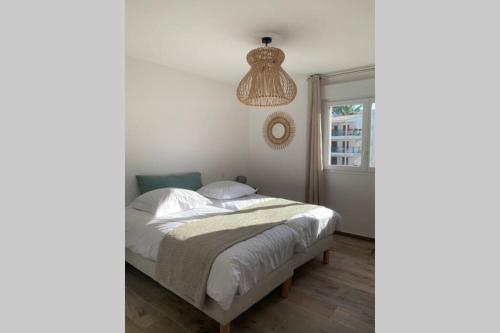 Postel nebo postele na pokoji v ubytování Appartement neuf sur Plage de Calvi Vue Mer