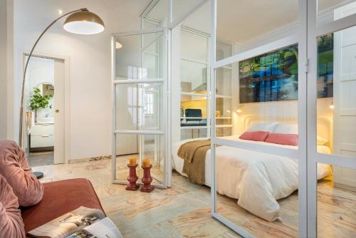 Ένα ή περισσότερα κρεβάτια σε δωμάτιο στο UNICO ALCAZAR Apartment