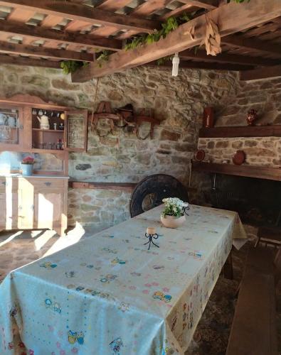 a table with a blue table cloth on it in a room at Casa Camariñas in Camariñas