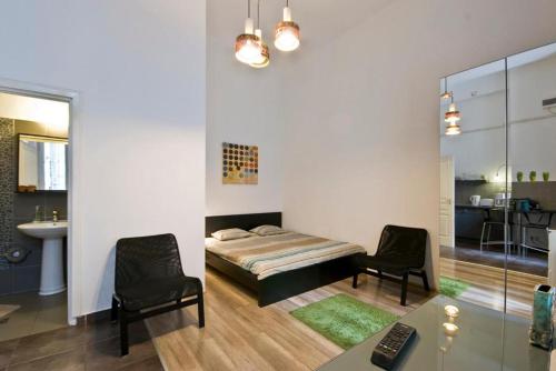 A bed or beds in a room at Balcony Apartment