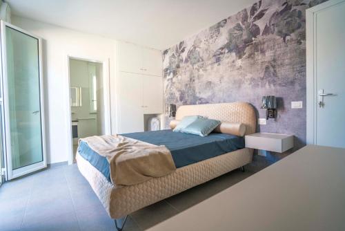 Postel nebo postele na pokoji v ubytování Villa le Agavi - exclusive holiday end event