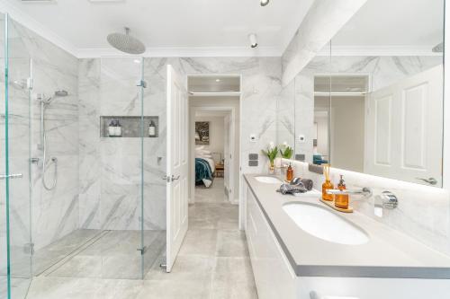 a bathroom with two sinks and a shower at Hall House in Bowral