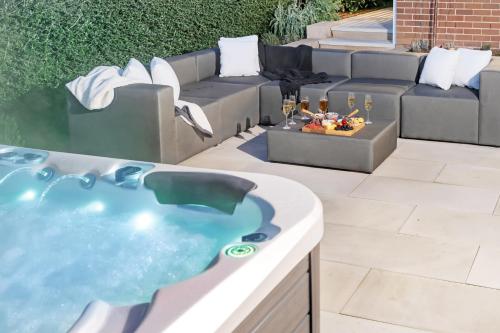 a hot tub in the middle of a patio at Hall House in Bowral