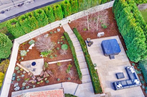 an overhead view of a garden with a blue bench at Hall House in Bowral