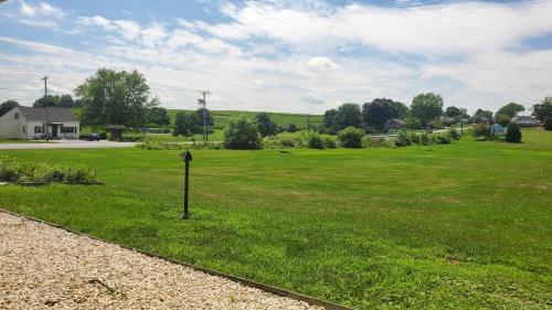 a field with a parking meter in the grass at Travelodge by Wyndham Hershey in Hershey