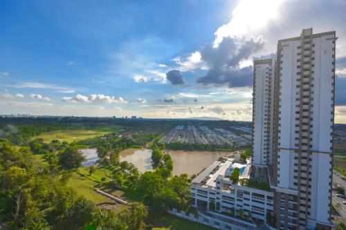 an aerial view of a tall building next to a river at Cube 8teens by Nest Home in Johor Bahru
