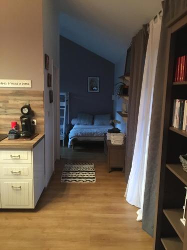 a bedroom with a bed and a desk in a room at My little sweet home in Colombe
