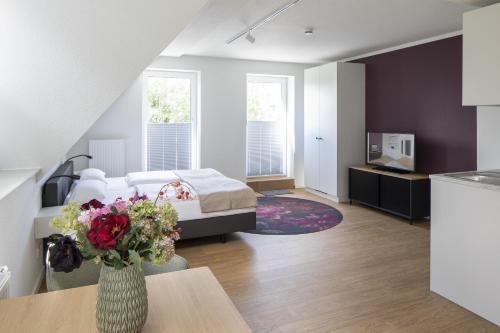 Postel nebo postele na pokoji v ubytování Hotel Upstalsboom Langeoog