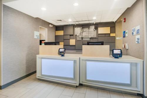 a waiting area at a hospital with two blank signs at Holiday Inn Express Hotel & Suites Orlando - Apopka by IHG in Orlando