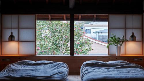 Llit o llits en una habitació de 宿一灯 Guest House HITOTOMORI