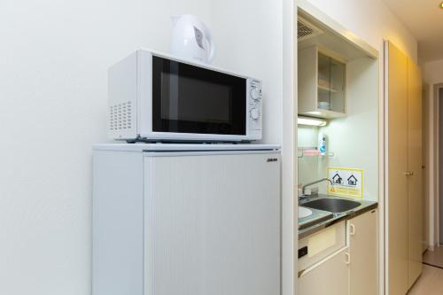 A kitchen or kitchenette at Asset Kita-Hatsutomi #MVx