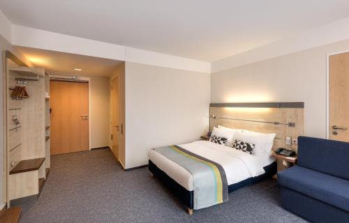 Ένα ή περισσότερα κρεβάτια σε δωμάτιο στο Holiday Inn Express Singen by IHG