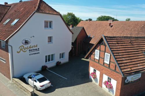 an overhead view of a building with a car parked outside at Gästehaus Rothert in Bramsche