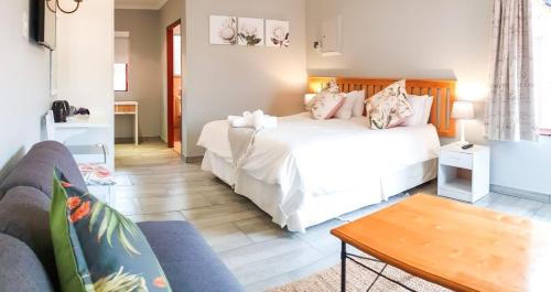 Ein Bett oder Betten in einem Zimmer der Unterkunft Thyme Inn on Greenway