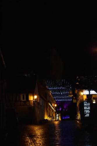 a night view of a building with lights at Appartments Rue Des Châteaux in Ottrott