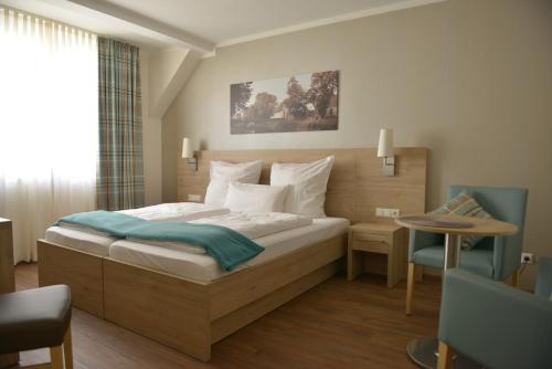 En eller flere senge i et værelse på Gästehaus Rothert
