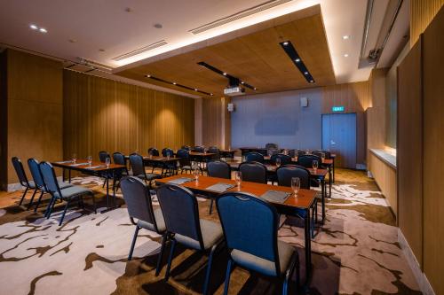 a conference room with tables and chairs in it at Hotel Nikko Hai Phong in Hai Phong