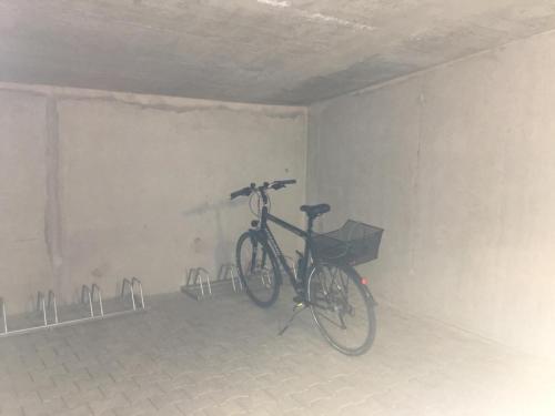 a bike parked in a room with a wall at SleepySleepy Hotel Dillingen in Dillingen an der Donau