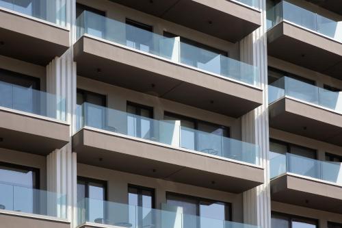 a facade of a building with glass balconies at Athens Panorama Project in Athens