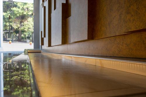 a hallway with a reflecting pool in a building at Athens Panorama Project in Athens