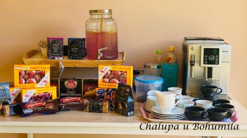 a counter with food and a coffee maker on it at Chalupa u Bohumila in Rybná nad Zdobnicí
