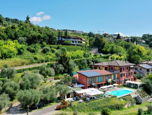 an aerial view of a house with a pool at Relais Villa Olivi in Costermano