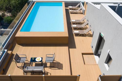 an overhead view of a swimming pool on a building at Athens Panorama Project in Athens