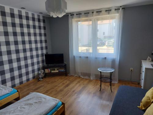 Кровать или кровати в номере Apartament wakacyjny Chałupy